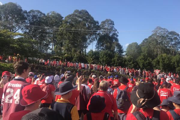 crowd of people wearing red shirts