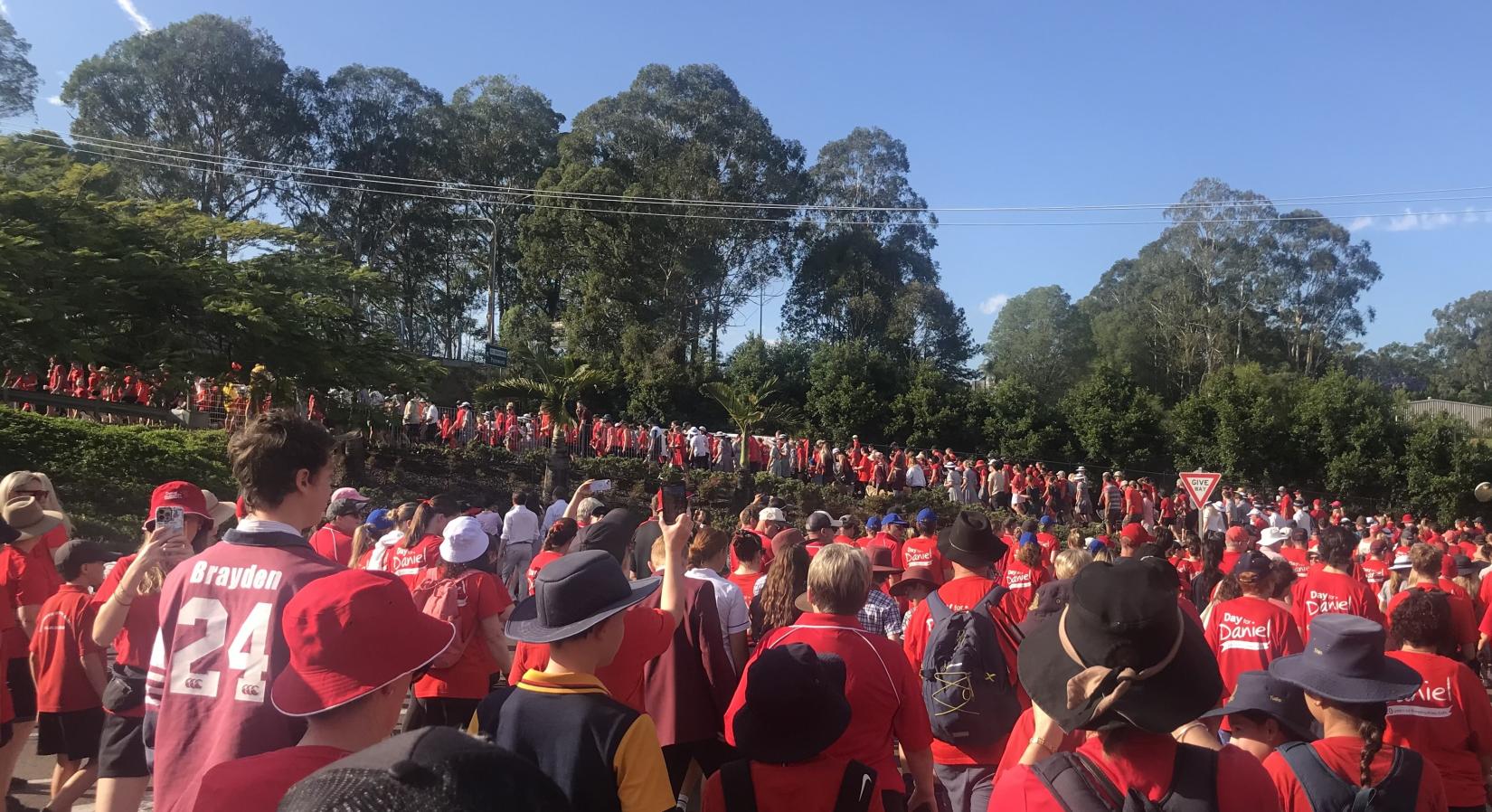 crowd of people wearing red shirts